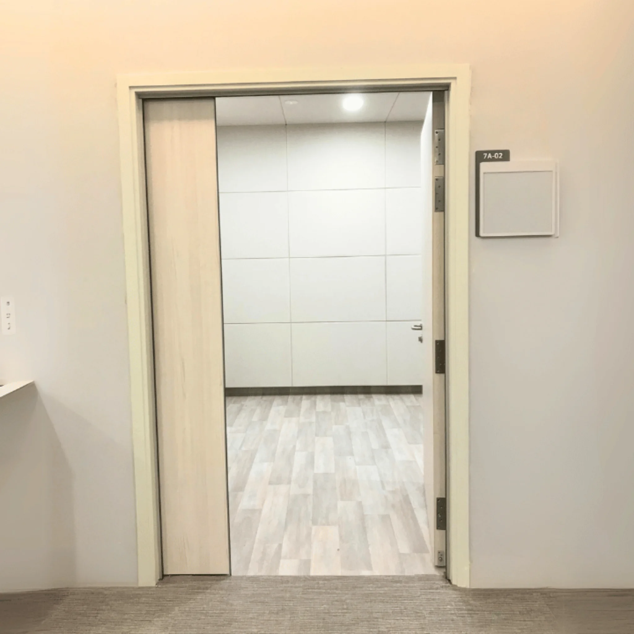 Heavy duty acoustic door frame with automated drop seal system